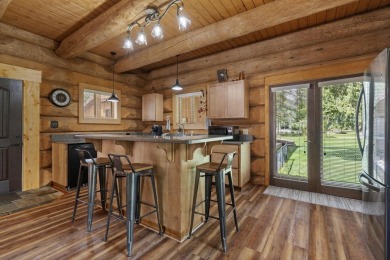 Escape the ordinary in this stunning log home sitting on just on Chewelah Golf and Country Club  in Washington - for sale on GolfHomes.com, golf home, golf lot