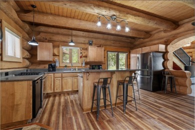 Escape the ordinary in this stunning log home sitting on just on Chewelah Golf and Country Club  in Washington - for sale on GolfHomes.com, golf home, golf lot