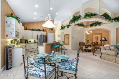 You are greeted by a lovely well maintained Front Garden. The on Halifax Plantation Golf Club in Florida - for sale on GolfHomes.com, golf home, golf lot