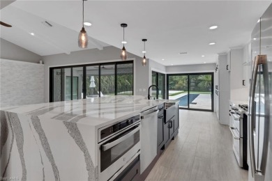 This beautifully redesigned home is nestled on an oversized lot on Imperial Golf Club in Florida - for sale on GolfHomes.com, golf home, golf lot