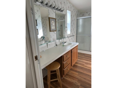 Discover this charming and well-maintained 3-bedroom home on Schalamar Creek Golf and Country Club in Florida - for sale on GolfHomes.com, golf home, golf lot