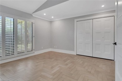 This beautifully redesigned home is nestled on an oversized lot on Imperial Golf Club in Florida - for sale on GolfHomes.com, golf home, golf lot
