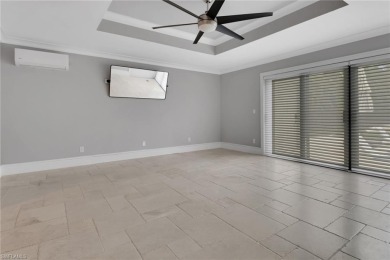 This beautifully redesigned home is nestled on an oversized lot on Imperial Golf Club in Florida - for sale on GolfHomes.com, golf home, golf lot