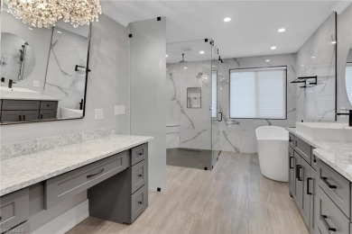 This beautifully redesigned home is nestled on an oversized lot on Imperial Golf Club in Florida - for sale on GolfHomes.com, golf home, golf lot