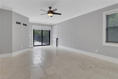 This beautifully redesigned home is nestled on an oversized lot on Imperial Golf Club in Florida - for sale on GolfHomes.com, golf home, golf lot