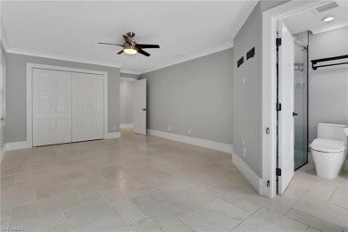 This beautifully redesigned home is nestled on an oversized lot on Imperial Golf Club in Florida - for sale on GolfHomes.com, golf home, golf lot