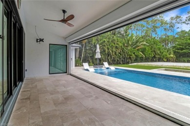 This beautifully redesigned home is nestled on an oversized lot on Imperial Golf Club in Florida - for sale on GolfHomes.com, golf home, golf lot
