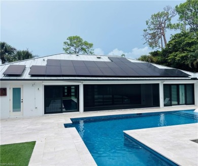 This beautifully redesigned home is nestled on an oversized lot on Imperial Golf Club in Florida - for sale on GolfHomes.com, golf home, golf lot