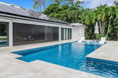 This beautifully redesigned home is nestled on an oversized lot on Imperial Golf Club in Florida - for sale on GolfHomes.com, golf home, golf lot