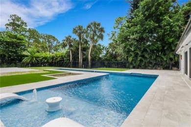 This beautifully redesigned home is nestled on an oversized lot on Imperial Golf Club in Florida - for sale on GolfHomes.com, golf home, golf lot