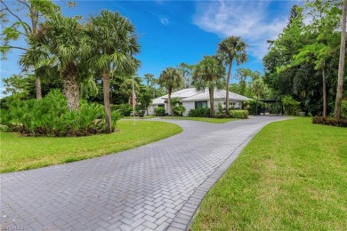 This beautifully redesigned home is nestled on an oversized lot on Imperial Golf Club in Florida - for sale on GolfHomes.com, golf home, golf lot