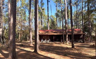 This authentic log cabin is priced to sell! Includes the on Holly Lake Ranch Golf Club in Texas - for sale on GolfHomes.com, golf home, golf lot