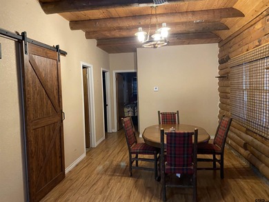This authentic log cabin is priced to sell! Includes the on Holly Lake Ranch Golf Club in Texas - for sale on GolfHomes.com, golf home, golf lot