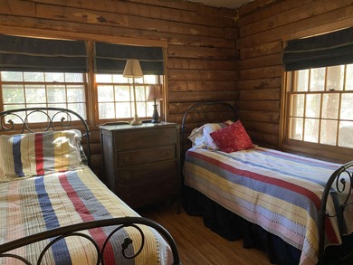 This authentic log cabin is priced to sell! Includes the on Holly Lake Ranch Golf Club in Texas - for sale on GolfHomes.com, golf home, golf lot