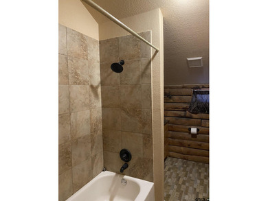 This authentic log cabin is priced to sell! Includes the on Holly Lake Ranch Golf Club in Texas - for sale on GolfHomes.com, golf home, golf lot