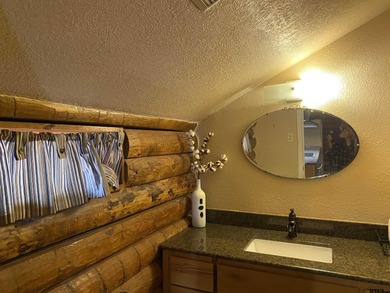 This authentic log cabin is priced to sell! Includes the on Holly Lake Ranch Golf Club in Texas - for sale on GolfHomes.com, golf home, golf lot