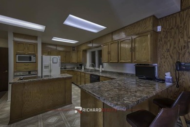 Step into this charming, expansive one-story brick home nestled on Olive Glenn Golf and Country Club in Wyoming - for sale on GolfHomes.com, golf home, golf lot