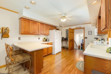Welcome to 'Fireside'!  This lovely lake cottage nestled inside on Alpine Lake Resort in West Virginia - for sale on GolfHomes.com, golf home, golf lot