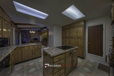 Step into this charming, expansive one-story brick home nestled on Olive Glenn Golf and Country Club in Wyoming - for sale on GolfHomes.com, golf home, golf lot