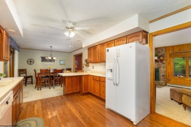 Welcome to 'Fireside'!  This lovely lake cottage nestled inside on Alpine Lake Resort in West Virginia - for sale on GolfHomes.com, golf home, golf lot