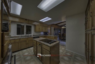 Step into this charming, expansive one-story brick home nestled on Olive Glenn Golf and Country Club in Wyoming - for sale on GolfHomes.com, golf home, golf lot