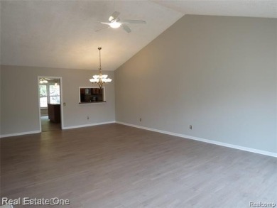 Welcome to this beautiful end unit condo in Country Club Village on Bushwood Golf Club in Michigan - for sale on GolfHomes.com, golf home, golf lot