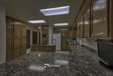 Step into this charming, expansive one-story brick home nestled on Olive Glenn Golf and Country Club in Wyoming - for sale on GolfHomes.com, golf home, golf lot
