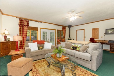 Welcome to 'Fireside'!  This lovely lake cottage nestled inside on Alpine Lake Resort in West Virginia - for sale on GolfHomes.com, golf home, golf lot