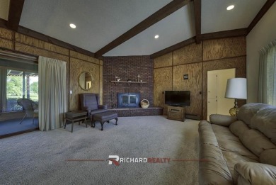 Step into this charming, expansive one-story brick home nestled on Olive Glenn Golf and Country Club in Wyoming - for sale on GolfHomes.com, golf home, golf lot