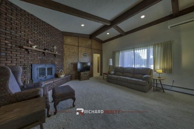 Step into this charming, expansive one-story brick home nestled on Olive Glenn Golf and Country Club in Wyoming - for sale on GolfHomes.com, golf home, golf lot
