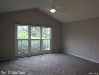 Welcome to this beautiful end unit condo in Country Club Village on Bushwood Golf Club in Michigan - for sale on GolfHomes.com, golf home, golf lot