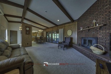 Step into this charming, expansive one-story brick home nestled on Olive Glenn Golf and Country Club in Wyoming - for sale on GolfHomes.com, golf home, golf lot