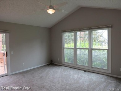 Welcome to this beautiful end unit condo in Country Club Village on Bushwood Golf Club in Michigan - for sale on GolfHomes.com, golf home, golf lot