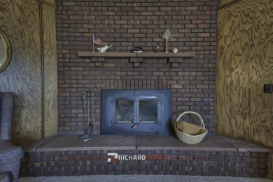 Step into this charming, expansive one-story brick home nestled on Olive Glenn Golf and Country Club in Wyoming - for sale on GolfHomes.com, golf home, golf lot