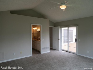 Welcome to this beautiful end unit condo in Country Club Village on Bushwood Golf Club in Michigan - for sale on GolfHomes.com, golf home, golf lot