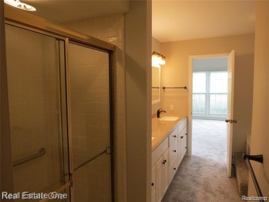 Welcome to this beautiful end unit condo in Country Club Village on Bushwood Golf Club in Michigan - for sale on GolfHomes.com, golf home, golf lot