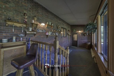 Step into this charming, expansive one-story brick home nestled on Olive Glenn Golf and Country Club in Wyoming - for sale on GolfHomes.com, golf home, golf lot