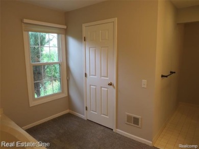 Welcome to this beautiful end unit condo in Country Club Village on Bushwood Golf Club in Michigan - for sale on GolfHomes.com, golf home, golf lot