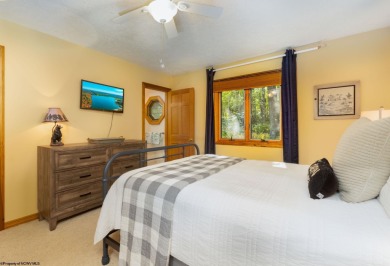 Welcome to 'Fireside'!  This lovely lake cottage nestled inside on Alpine Lake Resort in West Virginia - for sale on GolfHomes.com, golf home, golf lot
