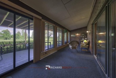 Step into this charming, expansive one-story brick home nestled on Olive Glenn Golf and Country Club in Wyoming - for sale on GolfHomes.com, golf home, golf lot