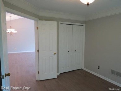 Welcome to this beautiful end unit condo in Country Club Village on Bushwood Golf Club in Michigan - for sale on GolfHomes.com, golf home, golf lot