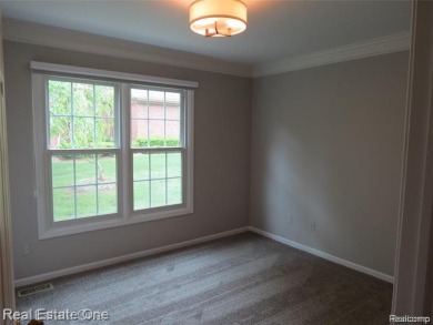 Welcome to this beautiful end unit condo in Country Club Village on Bushwood Golf Club in Michigan - for sale on GolfHomes.com, golf home, golf lot