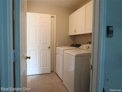 Welcome to this beautiful end unit condo in Country Club Village on Bushwood Golf Club in Michigan - for sale on GolfHomes.com, golf home, golf lot