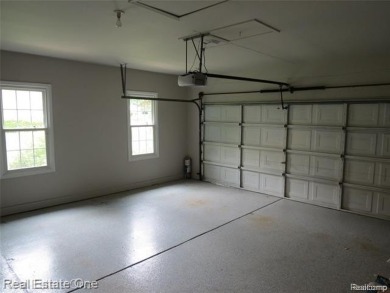 Welcome to this beautiful end unit condo in Country Club Village on Bushwood Golf Club in Michigan - for sale on GolfHomes.com, golf home, golf lot