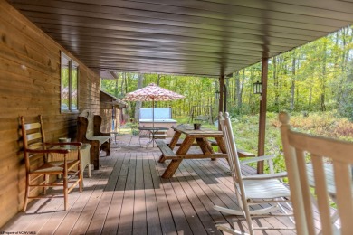 Welcome to 'Fireside'!  This lovely lake cottage nestled inside on Alpine Lake Resort in West Virginia - for sale on GolfHomes.com, golf home, golf lot