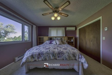 Step into this charming, expansive one-story brick home nestled on Olive Glenn Golf and Country Club in Wyoming - for sale on GolfHomes.com, golf home, golf lot
