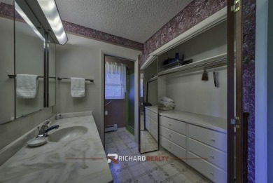 Step into this charming, expansive one-story brick home nestled on Olive Glenn Golf and Country Club in Wyoming - for sale on GolfHomes.com, golf home, golf lot