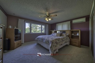 Step into this charming, expansive one-story brick home nestled on Olive Glenn Golf and Country Club in Wyoming - for sale on GolfHomes.com, golf home, golf lot
