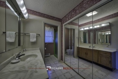 Step into this charming, expansive one-story brick home nestled on Olive Glenn Golf and Country Club in Wyoming - for sale on GolfHomes.com, golf home, golf lot