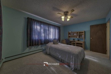 Step into this charming, expansive one-story brick home nestled on Olive Glenn Golf and Country Club in Wyoming - for sale on GolfHomes.com, golf home, golf lot